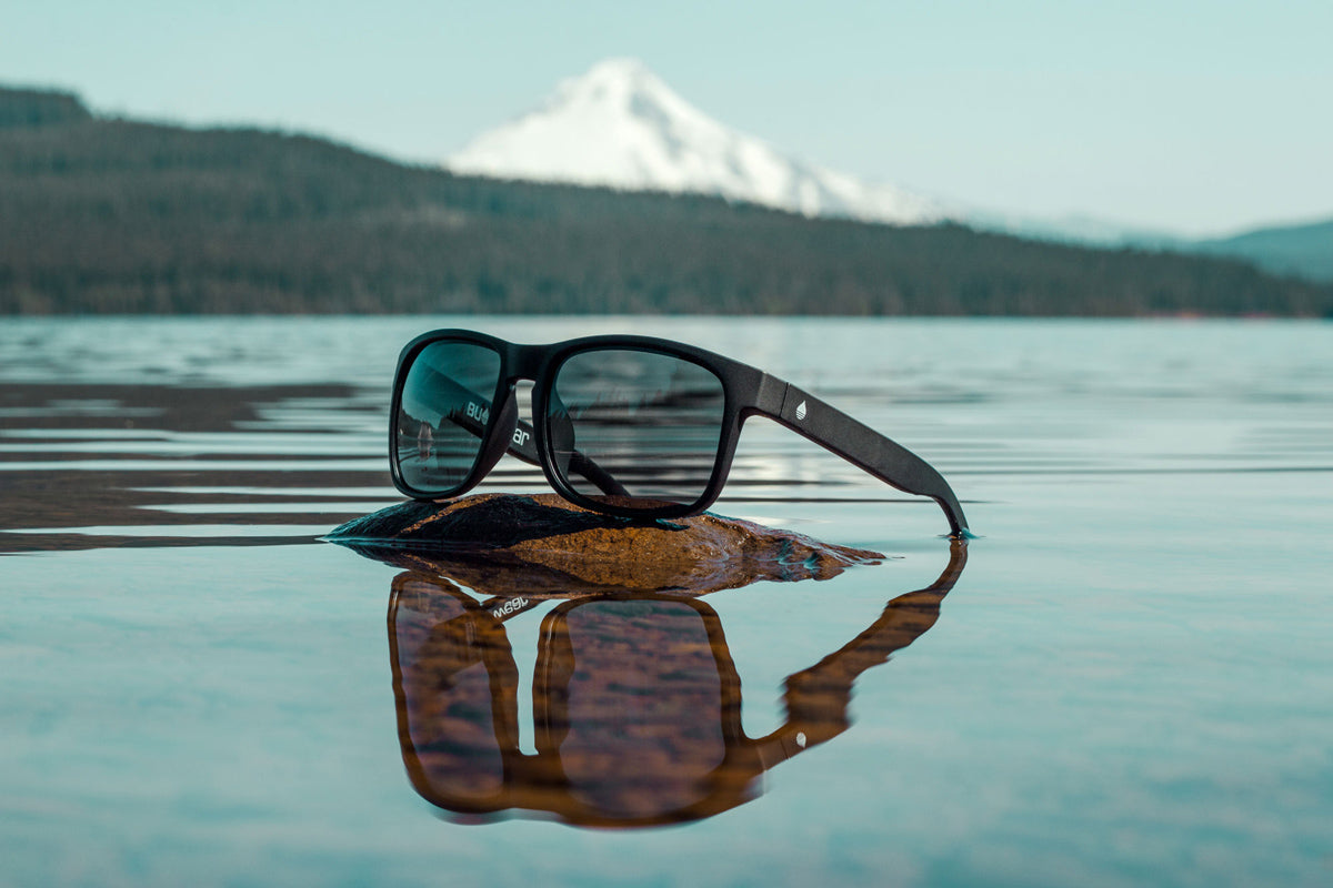 BUOY WEAR's black matte polarized floating sunglasses at the lake
