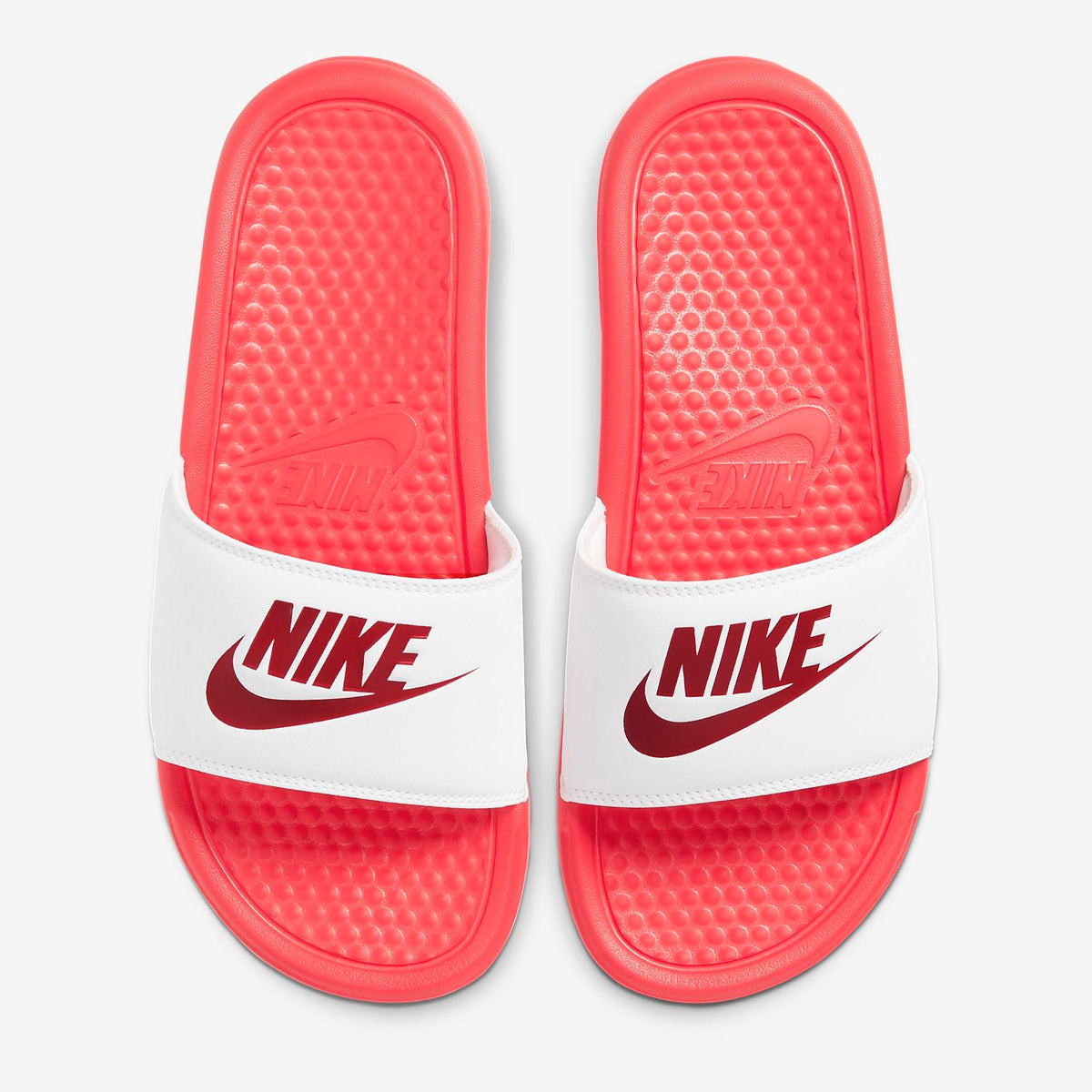 red and white fuzzy nike slides