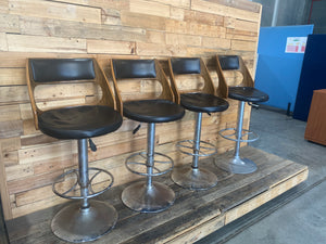 A Set Of Four Leather Bar Stools -Height Not Adjustable