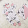 New baby gift set comprising a romper, blanket and headband made with bayridgecaskandkeg's Welcome to the world fabric which is white with black writing. The gift is accented with baby pink