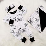New baby gift set comprising a romper, blanket and headband made with bayridgecaskandkeg's Welcome to the world fabric which is white with black writing. The gift is accented with black accents