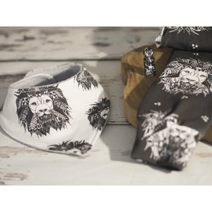 Monochrome exclusive Lion Noir kids Leggings designed by bayridgecaskandkeg and matching Aztec Lion bandana bib flat lay