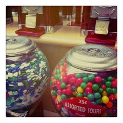 Curio & Co. enjoys candy from old-time vending machines. Photo of gum ball vending machines. Curio and Co. www.curioandco.com