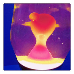 Curio & Co. relaxes with a 1960s Lava Lamp. Photograph of colorful lava lamp. Curio and Co. www.curioandco.com
