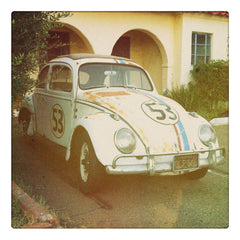 Curio & Co. takes the classic VW Bug Herbie for a spin. Photograph of an old run down Herbie VW bug. Curio and Co. www.curioandco.com