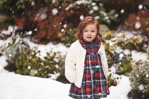 Amelie playing in the snow in her Ninon smocked dress! What a beauty!!
