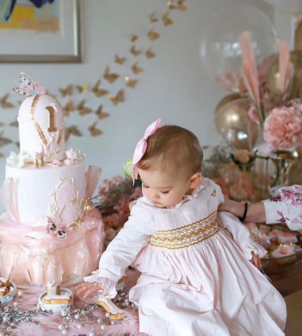 Pink velvet handmade smocked dress with golden details