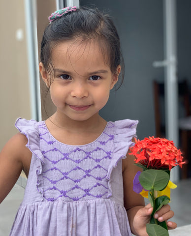 Olivia on holiday in her violet Netti smocked dress