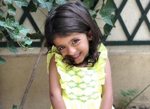 Beautiful little princess in her handmade yellow Netti dress.  Looking like a blooming flower, this darling is adorable! What a pleasure to see our dresses worn with such a big smile!