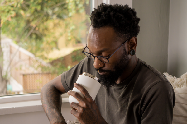 Man smelling coffee in Carter Everywhere Mug