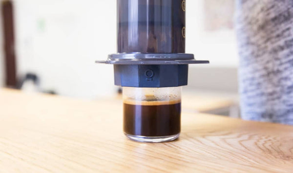 prismo brewing into espresso glass