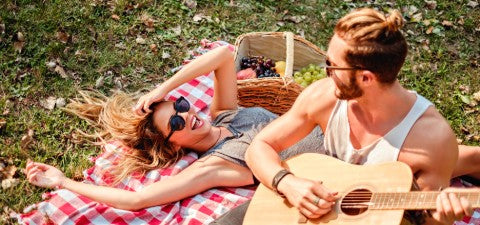 Couple hanging out in park