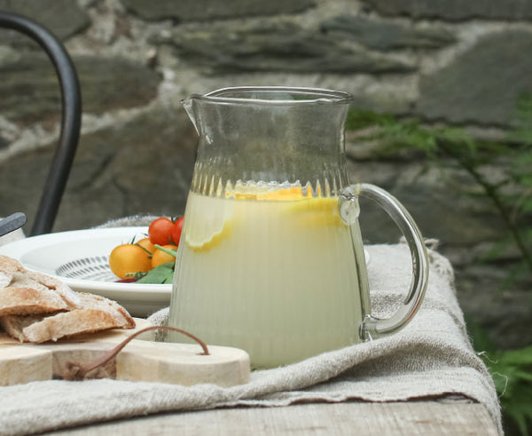 Lemonade in Glass Jug on table