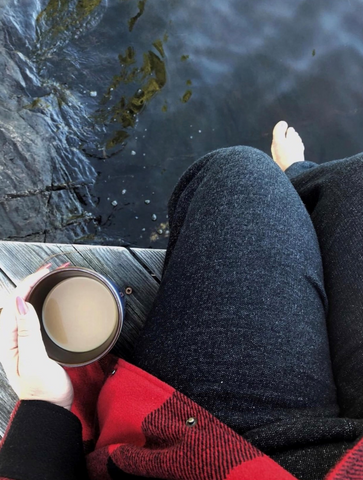 drinking coffee on the pier on the lake