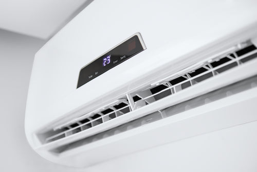 Split air conditioner on a white wall