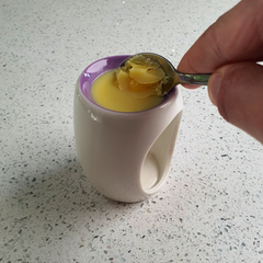 Removing wax melts from a wax burner using a spoon