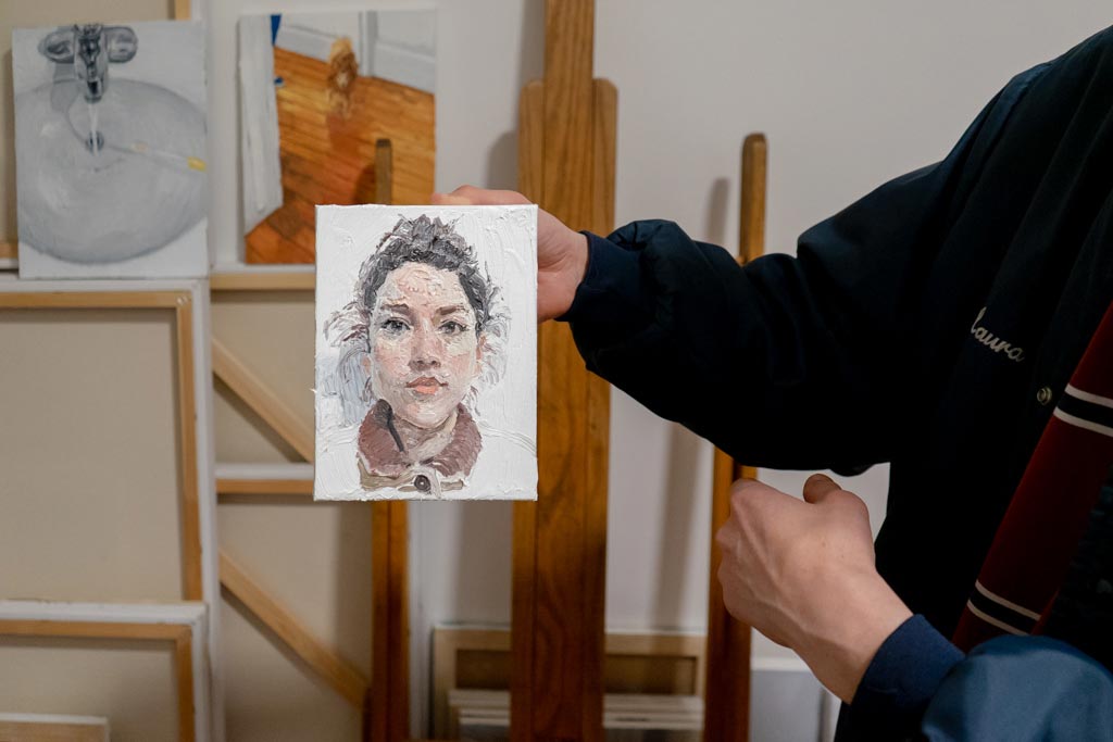 Emilio Villalba holding a painting