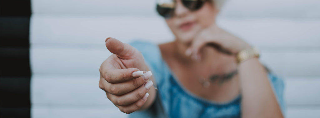 A woman reaching out with a helping hand.