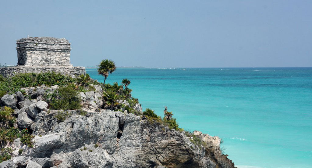 rocks and blue ocean tulum mexico mischa blog