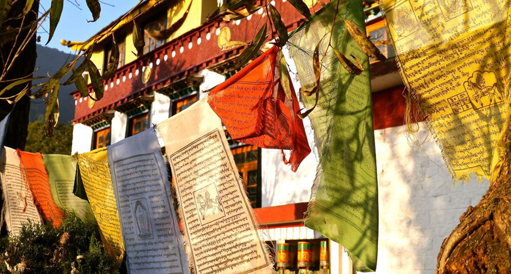 sanskrit on chiffon cloth flying at a retreat mischa blog
