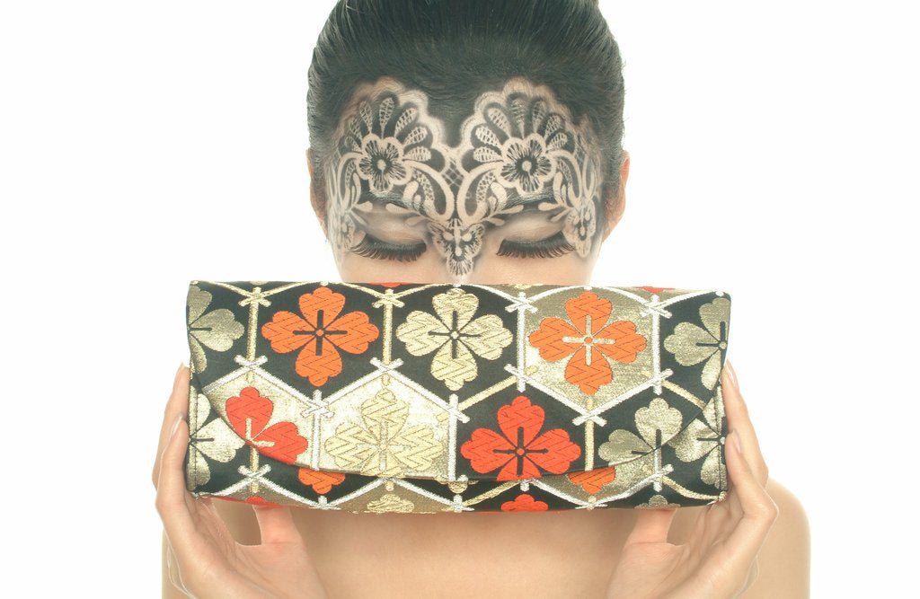 asian girl holding japanese obi clutch hexagon print mischa