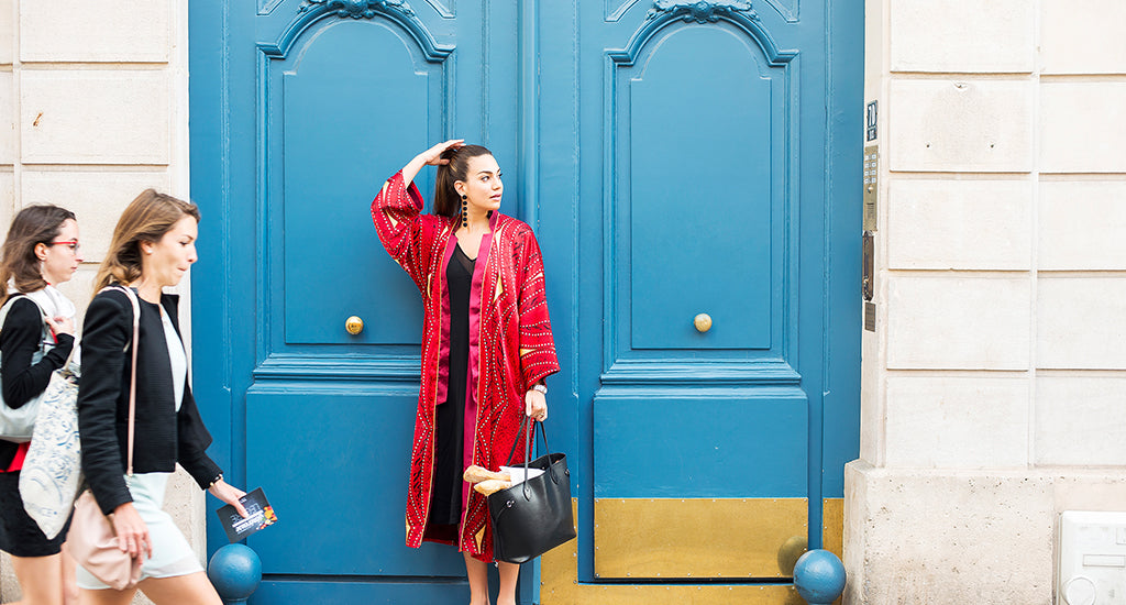 a woman standing in front of a blue door ;mischa blog
