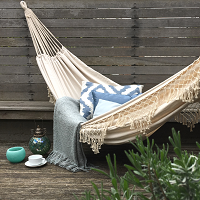 white tasselled hammock