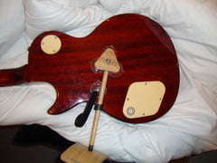 ergonomic guitar support. The Mundo Guitar Support being used on the right leg with heavy Les Paul guitar.