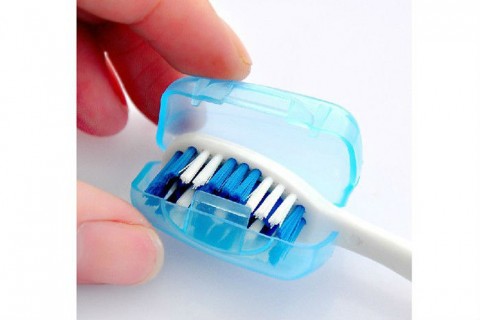 Open Blue Plastic Toothbrush Cover on Toothbrush