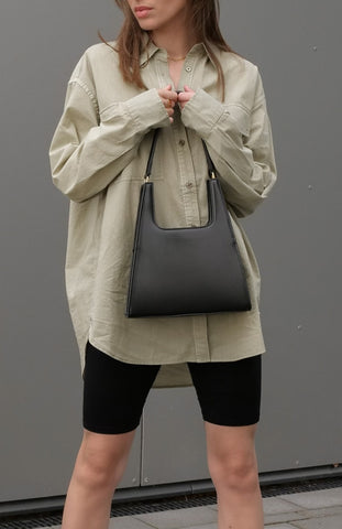 Tess Pelka wearing Jiyo Black Bag, Jeenaa Bags