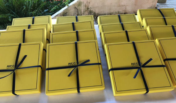 Yellow boxes with navy ribbon