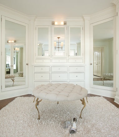 all-white dressing room with ottoman