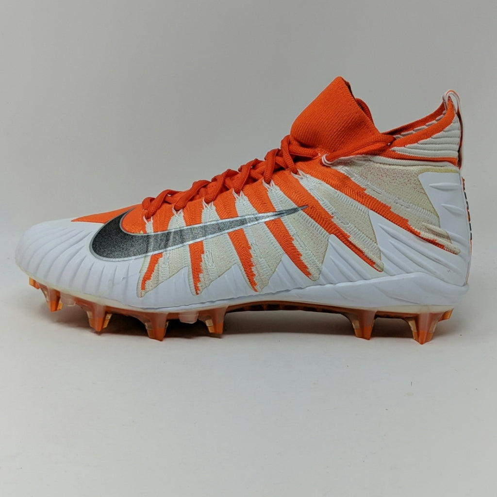 orange and white cleats