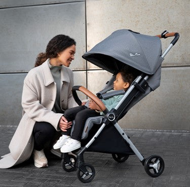 Woman looking at child in Silver Cross Jet 2020 stroller