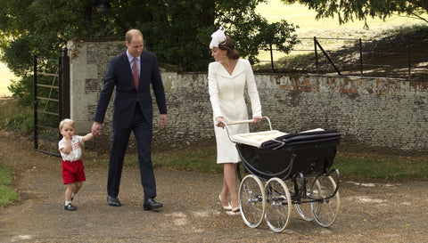 Modern royal family of England walking with Silver Cross Balmoral Pram