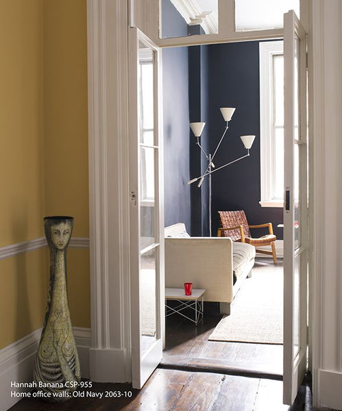 An office in a house painted with Benjamin Moore Hannah Banana and Hale Navy paint colors.