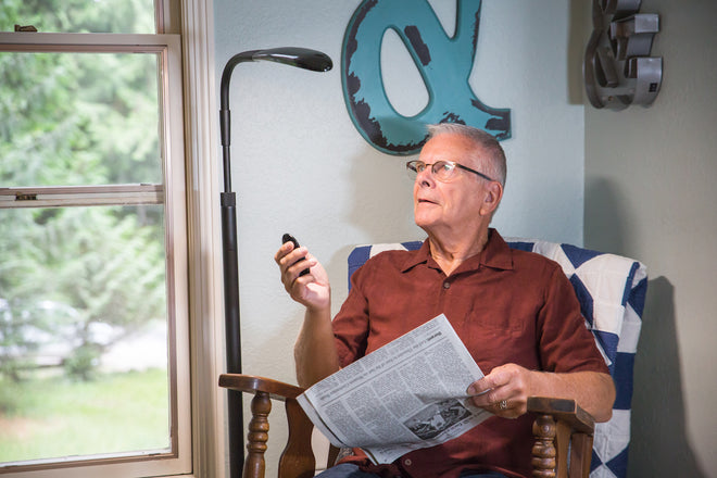 Man using Stella Sky to enjoy reading the newspapper