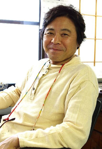 Junichi Hakose at his desk of Hakose Koubou Wajima Japan Photo Copyright by Kogei Styling