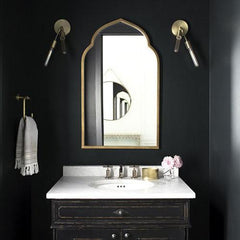 Powder room with ceiling painted the same color as walls for high impact.
