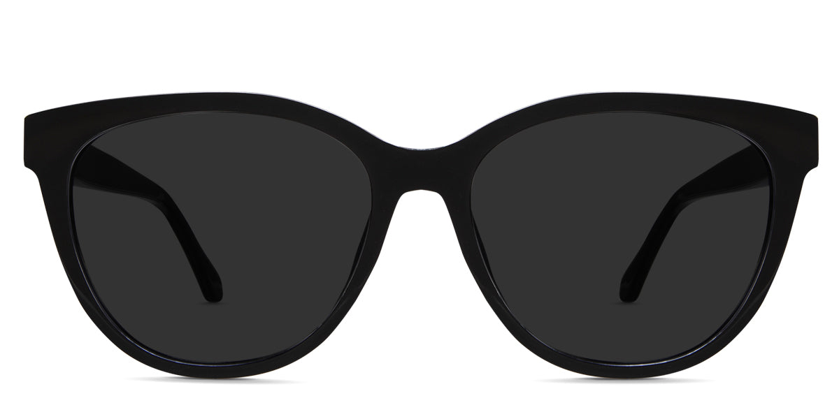 Gava black tinted glasses in onyx variant - a round frame with a touch of cat eye look on the top and end piece of the frame, and its lens provides a wide viewing area.