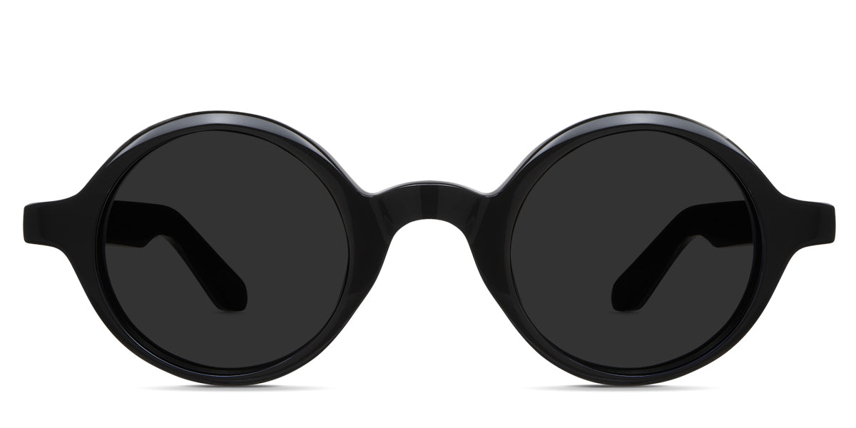 Naxo black tinted sunglasses in the midnight variant - it's a round frame with a U-shape nose bridge.