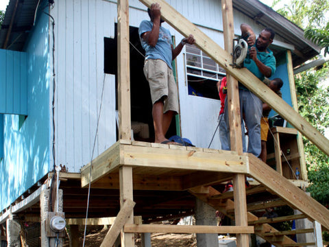 Building stairs at a home in St. Lucia, as part of Vision Express' One Community, One Vision programme.