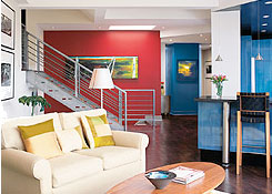A living room area painted and decorated with a dynamic colour scheme.