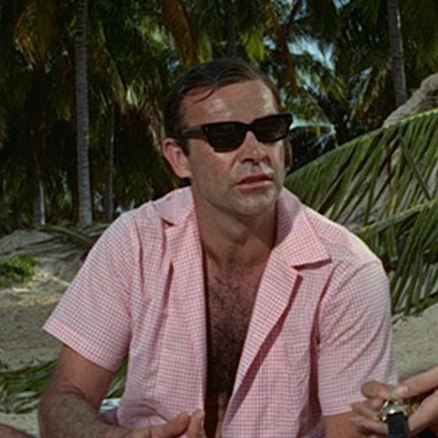 sean connery wearing a pink shirt
