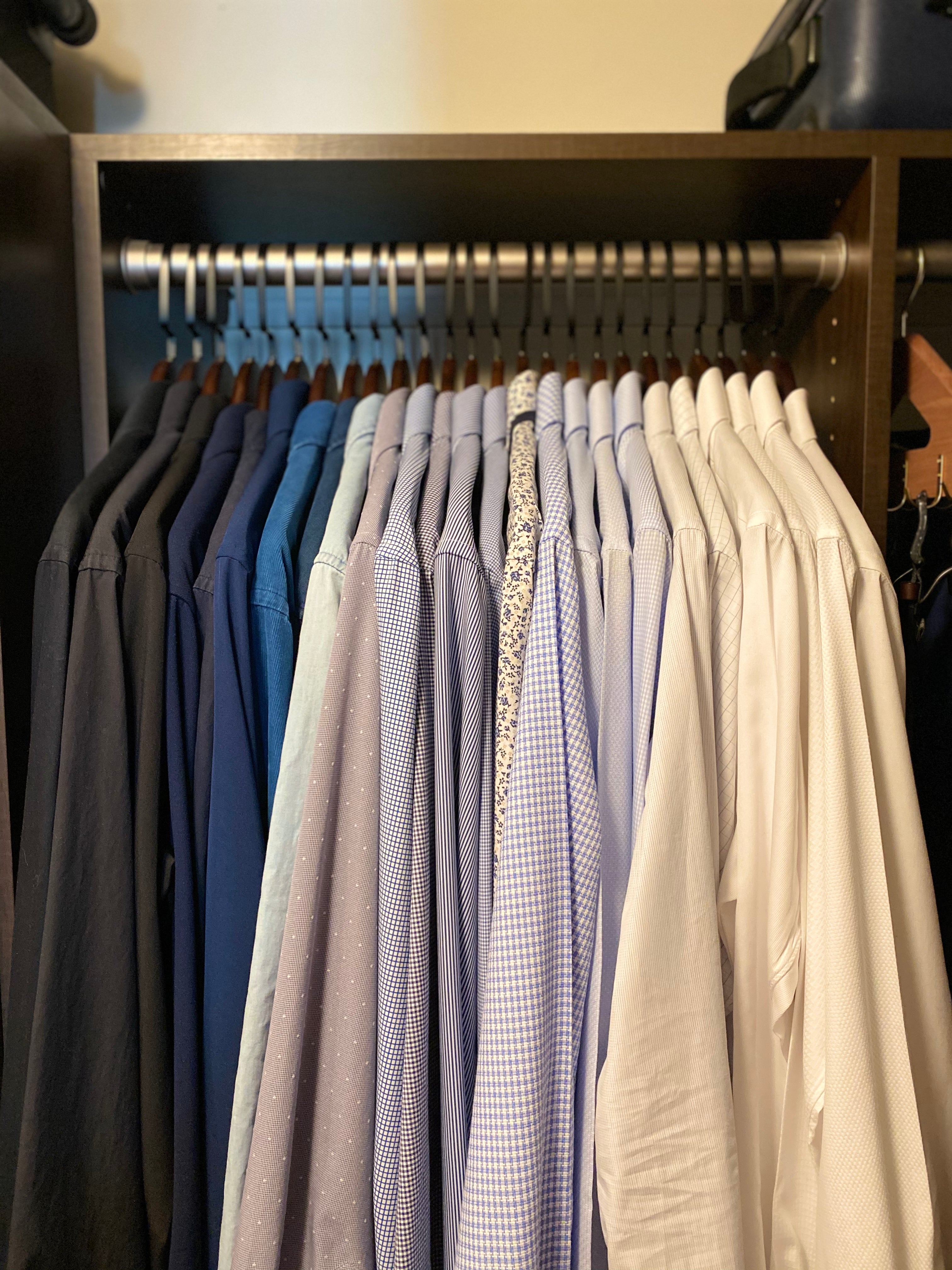 closet with color coordinate shirts and nice hangers