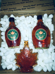 Glass bottles of syrup in packing peanuts