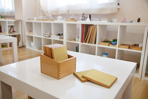 Montessori shelves for toys in playroom