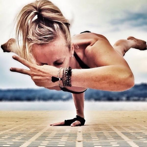 Yogi in One-Armed Peacock wearing YogaPaws Yoga Gloves