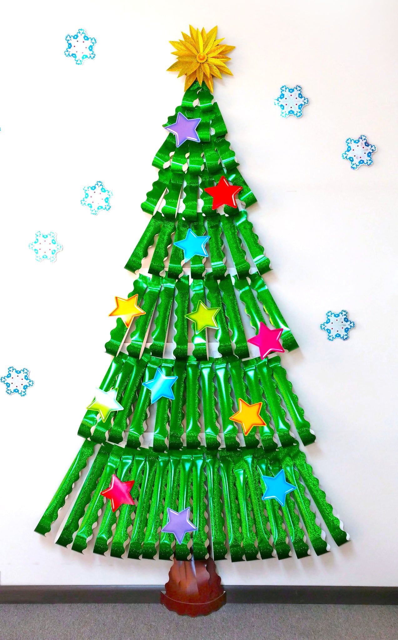 Christmas tree classroom wall decoration made from sparkle trimmers.
