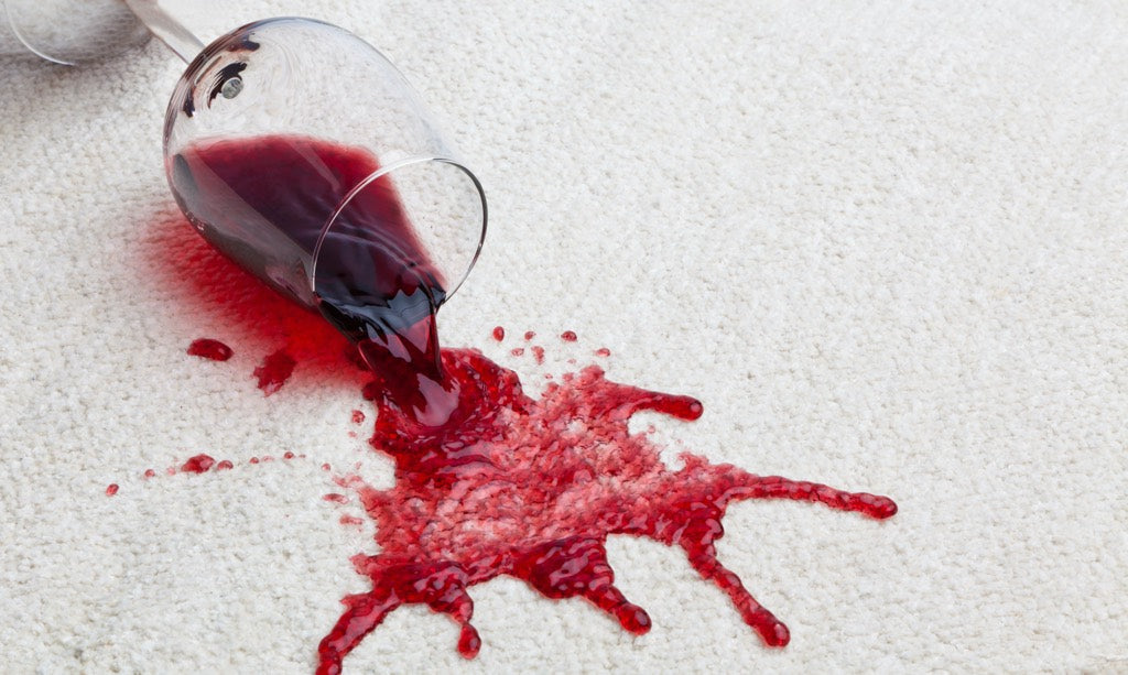 Red Wine Spill On White Area Rug